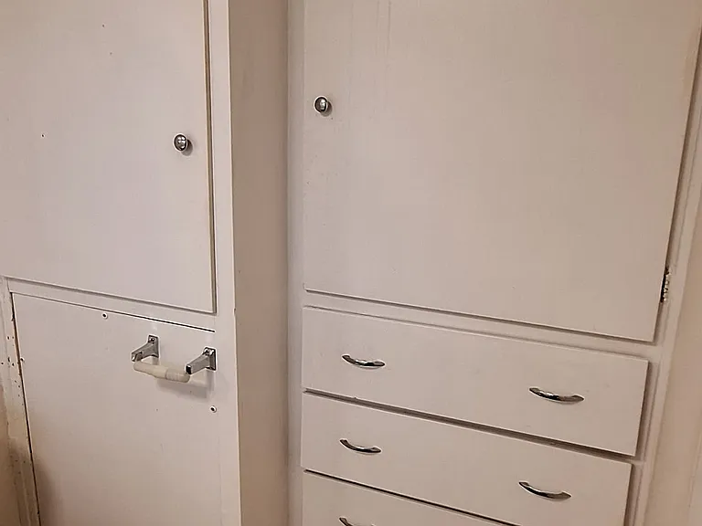 Lots of storage cabinets and drawers in bathrooom