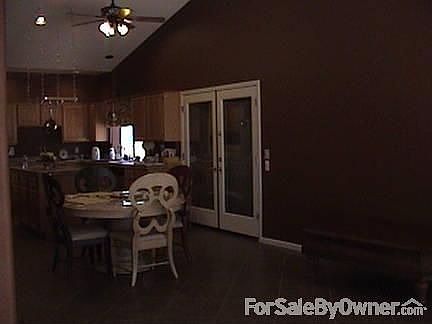 Kitchen and eating area.
						:
						Looking at kitchen and eating area from corner of family room.