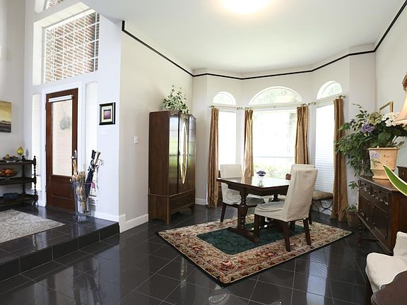 View showing the dining room and the entry. Very nice leaded front door and entry. Open floor plan a