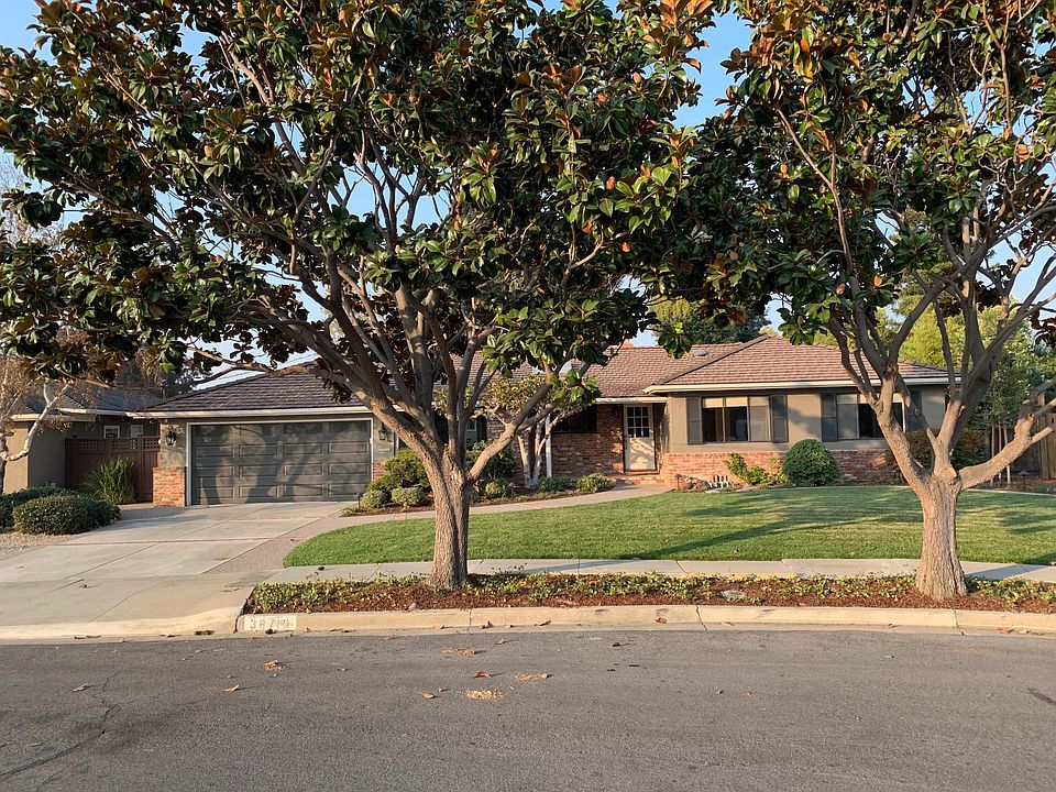 Freshly painted with new classic rubbed bronze light fixtures. Automatic landscape lighting front and back provides an inviting amber glow at night. Large mature magnolia trees help set the home off and offer a sense of privacy.