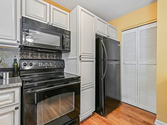 Laundry area is right off kitchen (shown by folding doors)