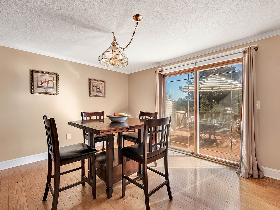 Dining area with slider out to large deck