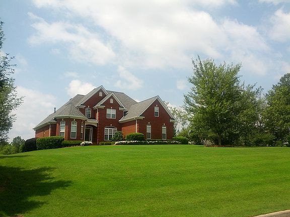 Massive manicured front lawn