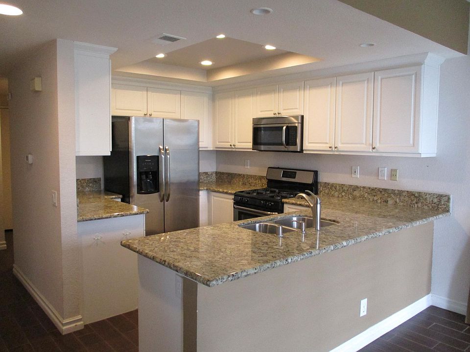Kitchen includes granite counter tops and stainless steel ap
