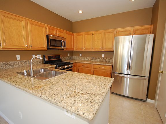 KITCHEN with new LG appliances (refrig, dishwasher, gas stove, micro) and sink