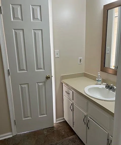 Sink view across from toilet area