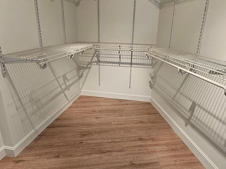 Large walk in closet with shelving