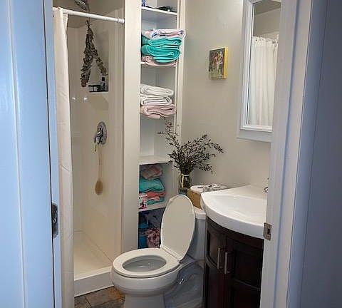 Full Bath with Shower & Linen Shelves