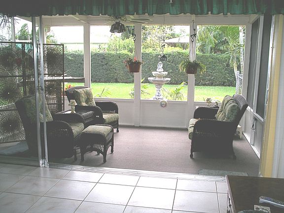 BACK PORCH OPEN TO LIVING ROOM
