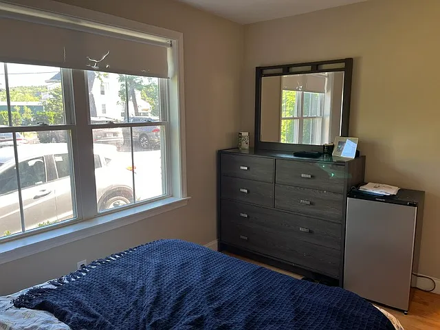 Sunny bedroom with large double window.