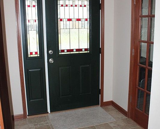 entry way with decorative tile floor