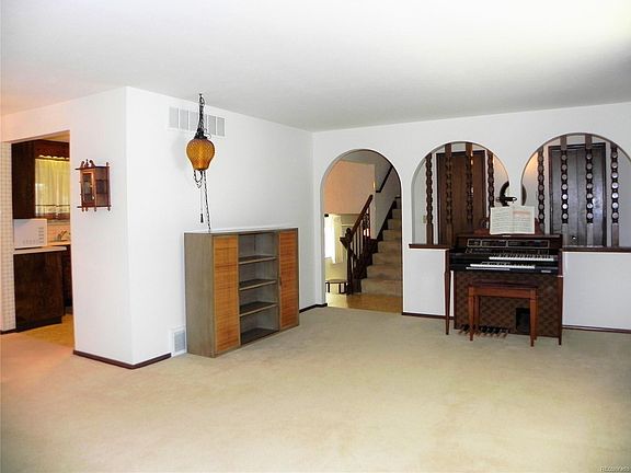Formal Living Room. Entry to kitchen and upper stairs.