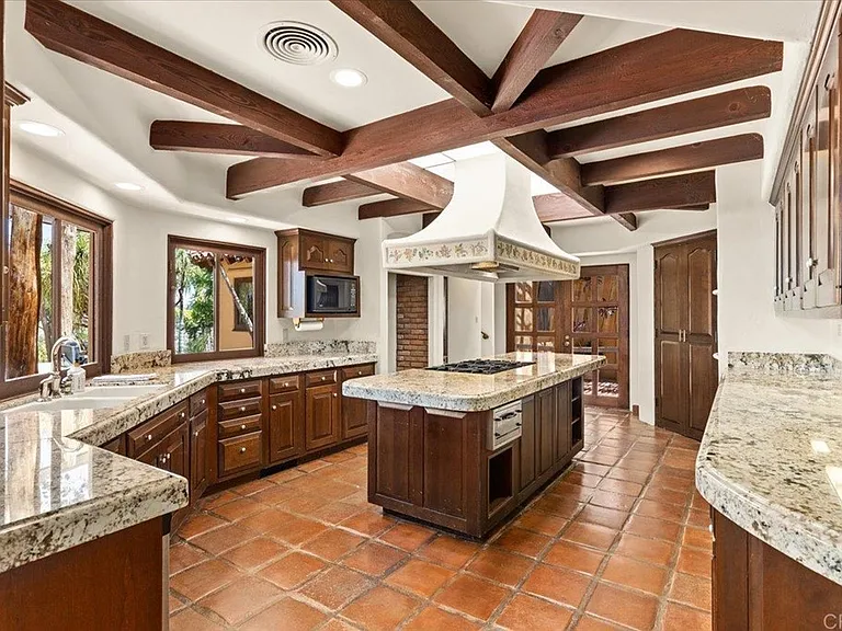 Kitchen has professional six burner gas stove