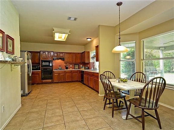 This spacious kitchen offers plenty of storage and cabinet space.  You can have more than one cook in this kitchen.  Enjoy the bright breakfast nook located right off the kitchen.