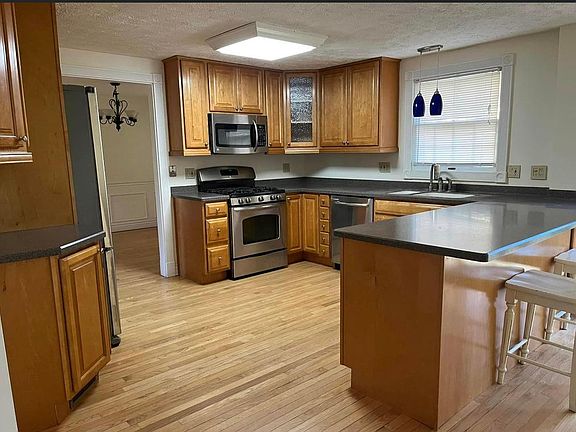Kitchen with Corian counters and high quality cabinets.