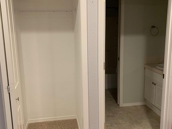 Storage closet next to kitchen and bathroom