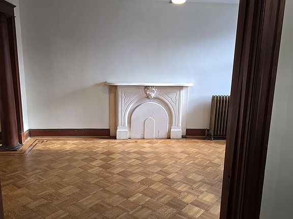 Marble Mantelpiece in the Living Room. Pocket Doors Close for Privacy