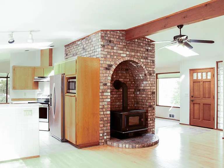 Front door, side view of kitchen.