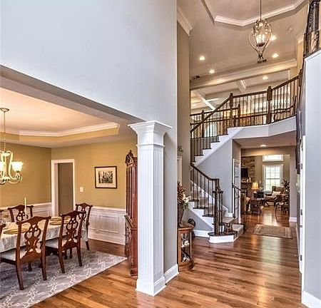 Grand Foyer sets the tone for the rest of this special home! Loaded with architectural  details and millwork throughout! Gleamin