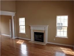 Great room with hardwood floors and fireplace