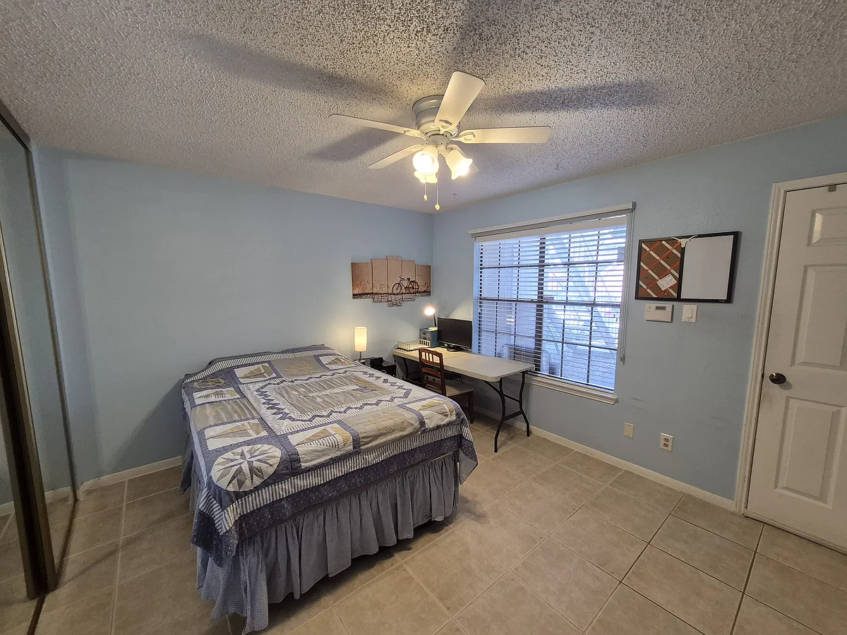 Bedroom. Full size bed, desk, and bookshelf will be included. All other pictured items will be removed before move-in. - 2300 Old Spanish Trl #1068