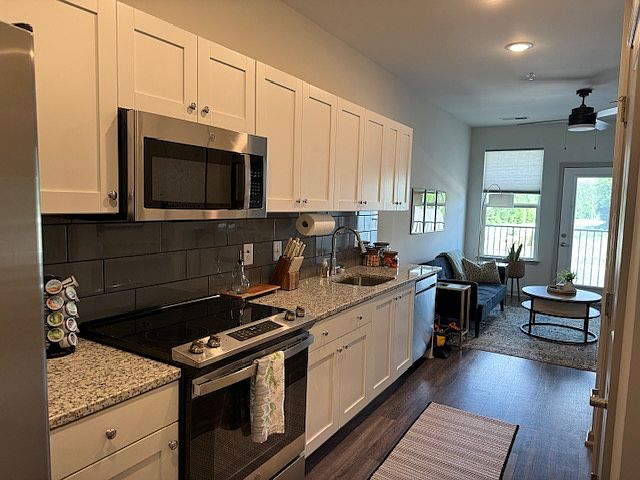 A view of the kitchen from the front door.