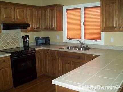 Roomy kitchen with lots of storage
						:
						Beautiful tile.
