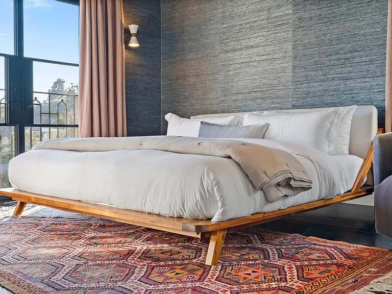 Crisp linens, organic textures, and thoughtful amenities throughout.