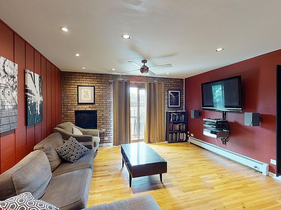 Living Room with fireplace and balcony