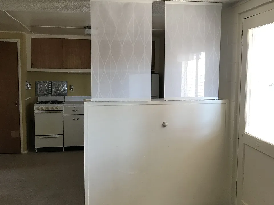 View from Living area to Kitchen. New paint throughout.