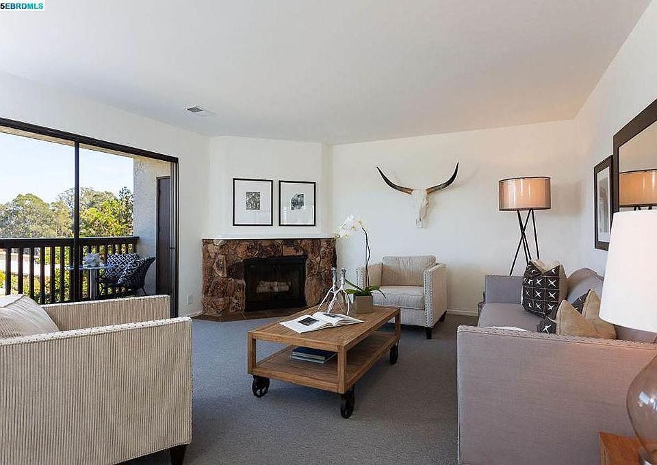 Living room with fireplace and expansive view