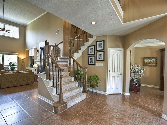 A spacious entry welcomes you inside. High ceilings, crown molding, tile floors; Wow!!