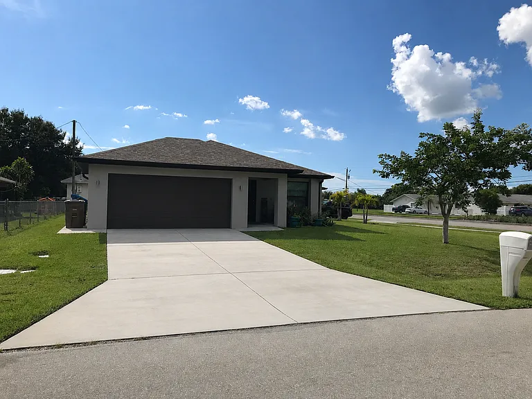 This property features a smart dual-apartment construction situated on a corner lot offering a unique layout that ensures privacy for each unit. Designed with convenience in mind each apartment boasts its own separate entrance located on different streets