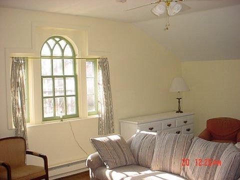 Living room corner of Studio Apt. Sleeping area far right.