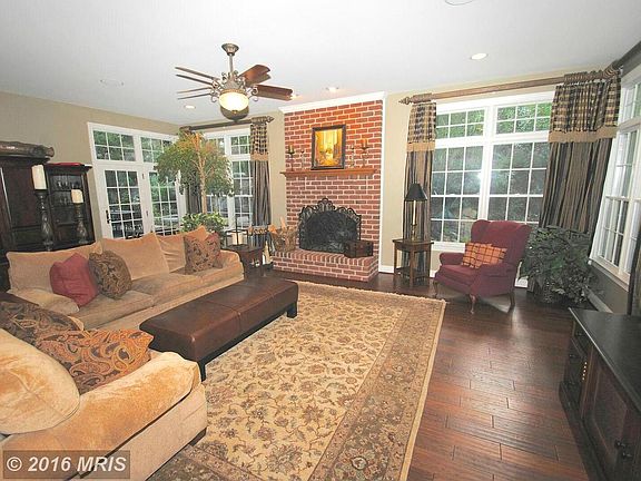 Step down family room w/ brick FP