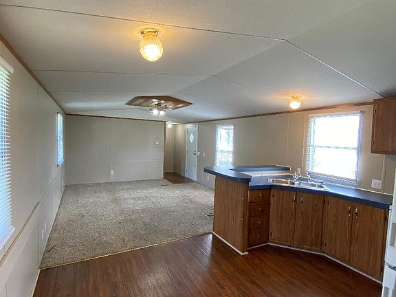 Kitchen and Living view from laundry hall way