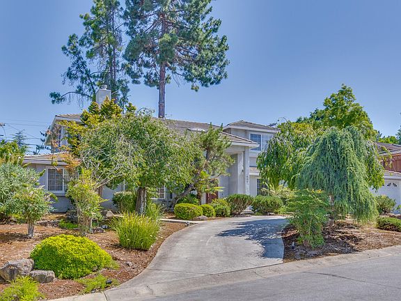 Fantastic 5-bedroom, 4.5-bath, two-level executive home situated on a tree-lined street in the prime Woodland Acre neighborhood of Los Altos.