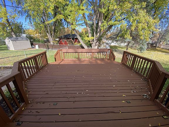 Large deck in fenced in backyard