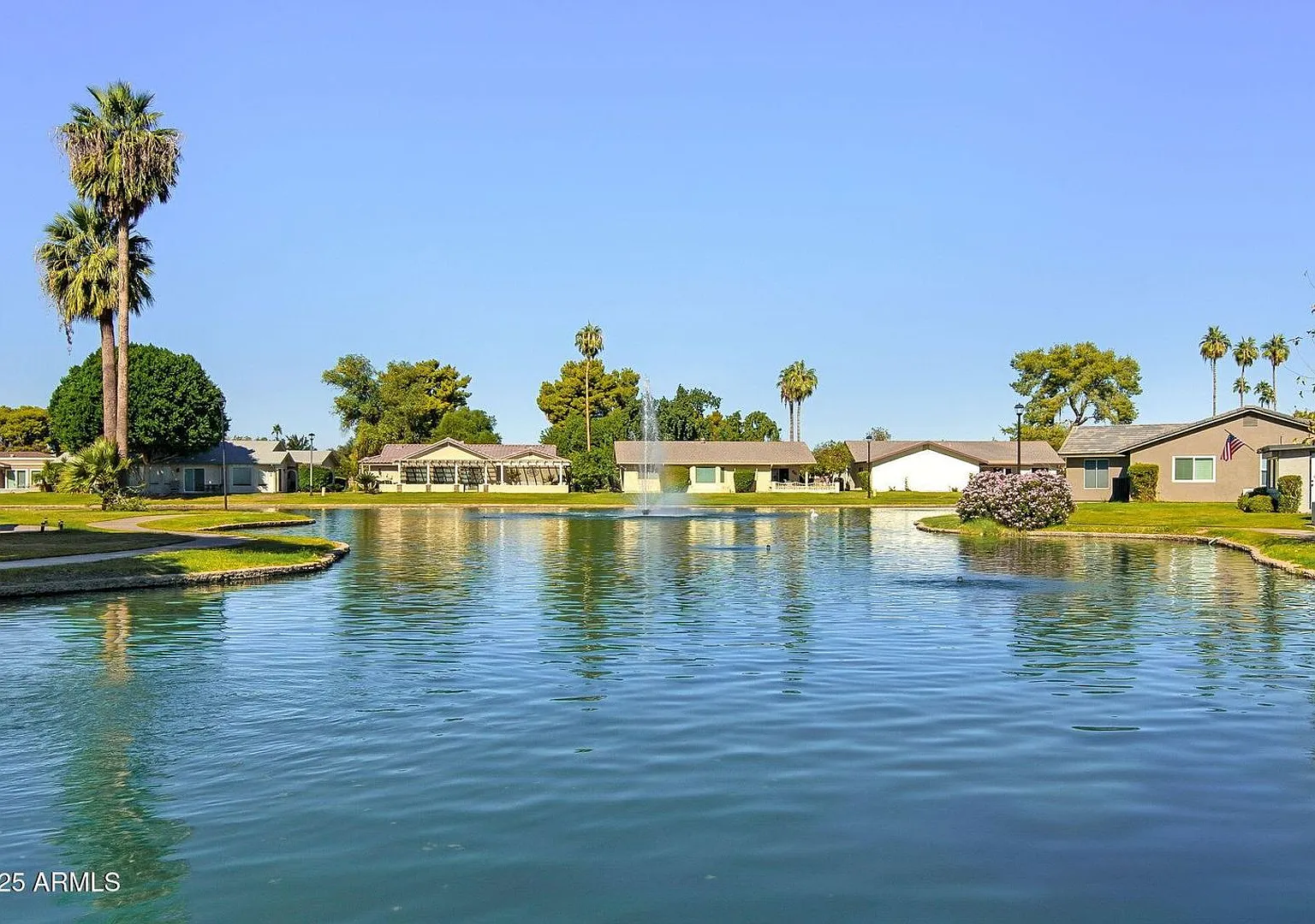 Welcome to this stunning updated 2-bedroom, 2-bathroom home on a lake located in the vibrant comm... — Photo 1