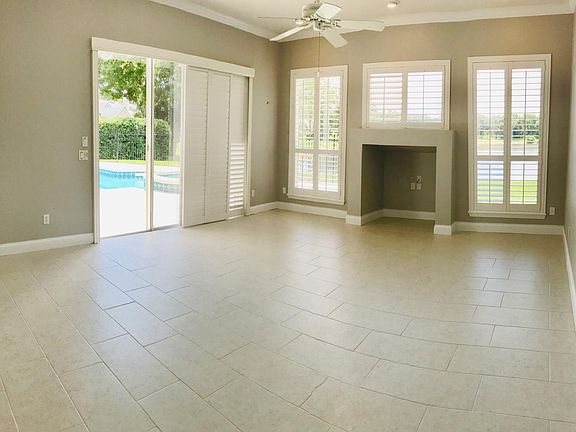 Family room over looks pool and golf course.