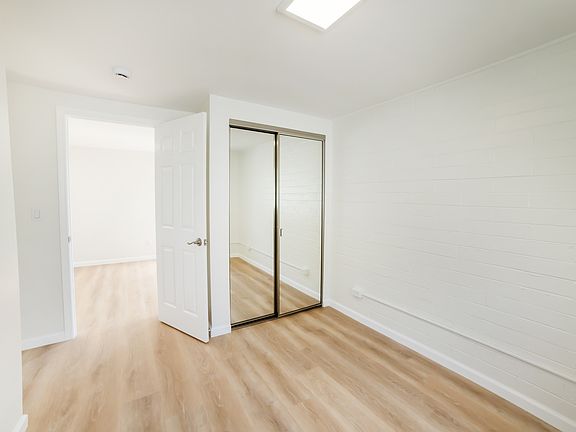 bedroom with mirrored closet