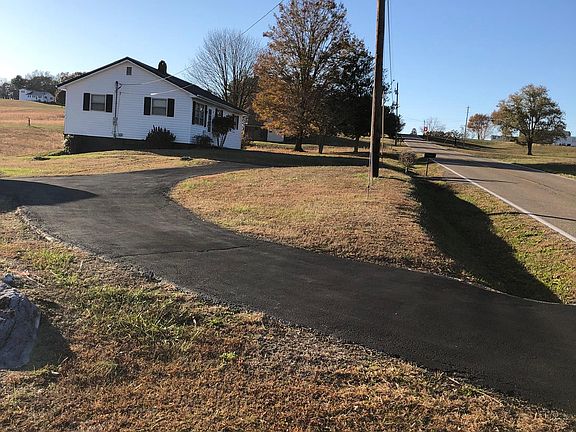 Side yard and paved driveway