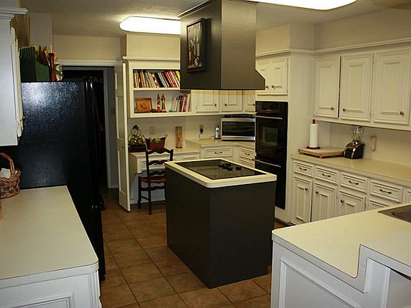 Another view of huge kitchen with easy access to dining room, breakfast nook & open to family room