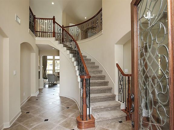 The opulence of the home which is carried throughout the home, begins with it's palatial entrance.