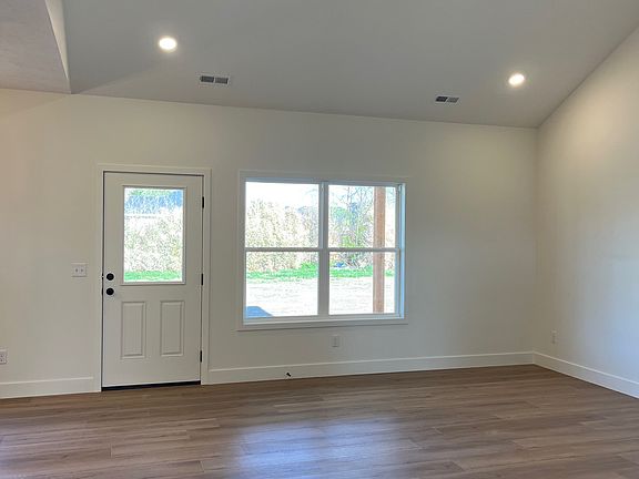 Spacious living room with a vaulted ceiling.