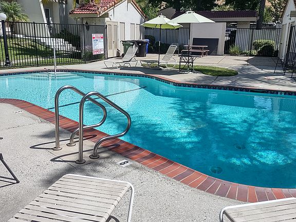 The pool is right outside the front door. This was resurfaced and reopened in summer 2024.