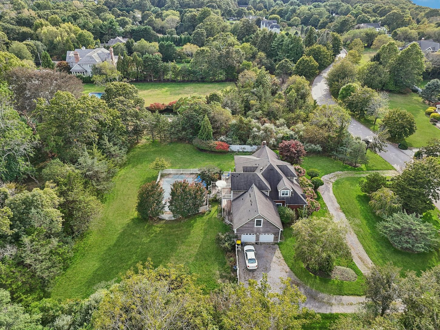 Aerial side perspective showcasing the property’s two-car attached garage.