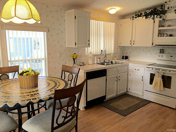 Large kitchen with lots of windows and pantry