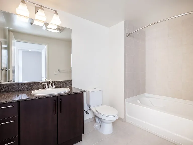 Classic Phase III bath with granite countertops and espresso cabinetry