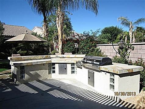 Outdoor dining under the extended covered patio and at the c